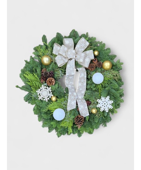 The Northwest Winter Wreath captures the serene beauty of a snowy Northwest winter. Built on a lush foundation of fragrant evergreens—noble fir, cedar, and pine