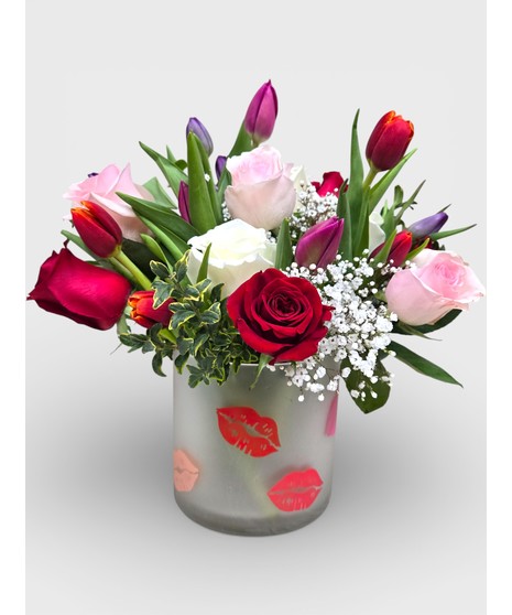 Let two lips meet this Valentine's after gifting this best-selling arrangement full of red and pink roses and tulips!