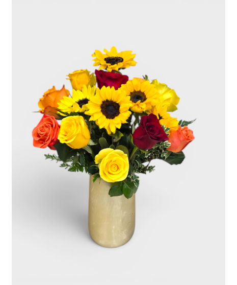 Roses and sunflowers in a charming yellow container