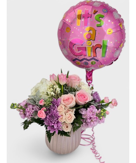 Presented with a Mylar balloon declaring, 