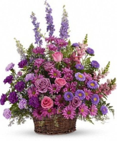 Purple tulips, fuchsia spray roses, lavender carnations, lavender larkspur, lavender button poms, jade spider chrysanthemums, green hypericum berries and more.