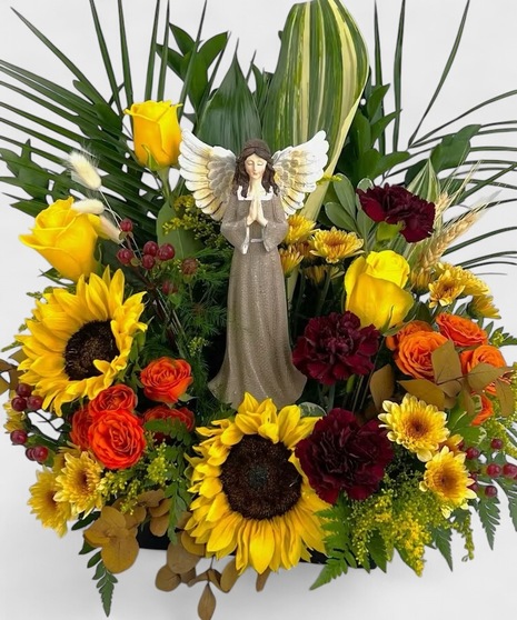 Autumn angel stands apart from other fall gifts. Fresh flowers in pale yellow, bronze and orange surround this gorgeous angel.