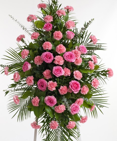 Classic pink easel display featuring complementing roses and carnations. Approximate size of the standard design is 28