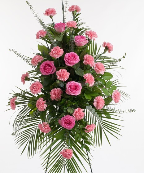 Classic pink easel display featuring complementing roses and carnations. Approximate size of the standard design is 28