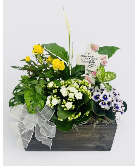 The In Memory Garden from Stadium Flowers is a haven of tranquility, carefully crafted to provide a sense of calm and reflection. 