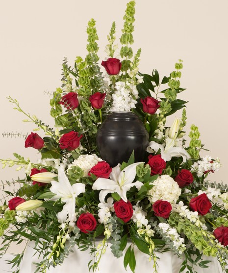 Customized Red and White Memorial Display featuring roses, lilies, and other accent flowers. This arrangement can be made to hold up to an 8