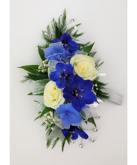 A designers choice of mixed floral blooms in your choice of colors. Includes keepsake Rhinestone wristlet, crystal pins, and accents!