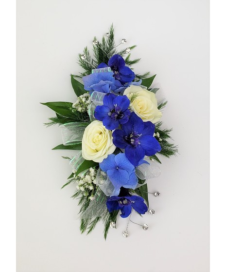 A designers choice of mixed floral blooms in your choice of colors. Includes keepsake Rhinestone wristlet, crystal pins, and accents!
