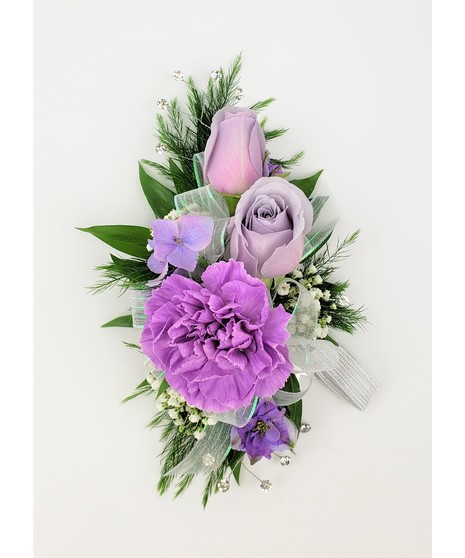 A designers choice of mixed floral blooms in your choice of colors. Includes keepsake Rhinestone wristlet, crystal pins, and accents!
