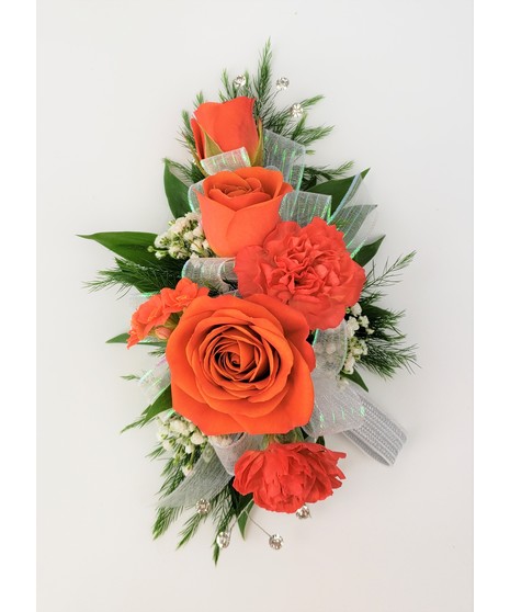 A designers choice of mixed floral blooms in your choice of colors. Includes keepsake Rhinestone wristlet, crystal pins, and accents!
