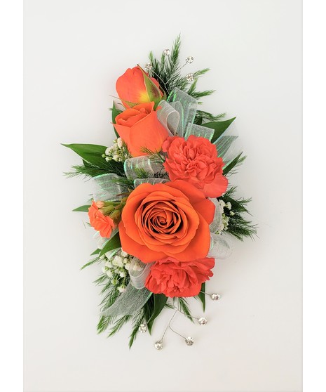 A designers choice of mixed floral blooms in your choice of colors. Includes keepsake Rhinestone wristlet, crystal pins, and accents!