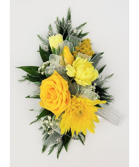 A designers choice of mixed floral blooms in your choice of colors. Includes keepsake Rhinestone wristlet, crystal pins, and accents!